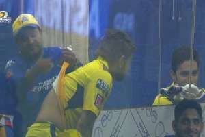 Possible rewritten title: “CSK Captain MS Dhoni’s Lower Back Treatment Picture Goes Viral, Sparking Speculation on Possible Injury”