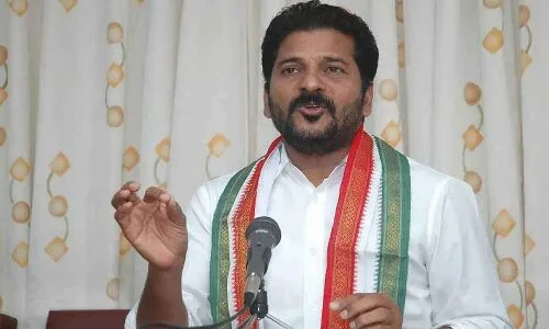 Revanth Reddy accuses KCR of involvement in land grab through painting analogy.