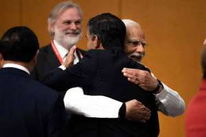 Biden and Sunak embrace with PM Modi