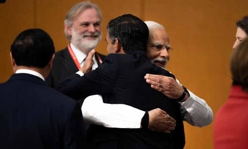 Biden and Sunak embrace with PM Modi