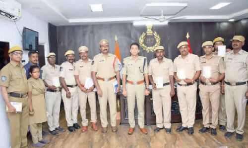 Home guards in Sircilla receive health cards from SP Akhil Mahajan
