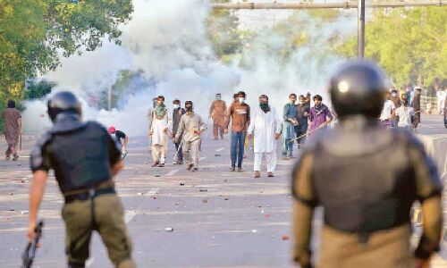 Imran Khan arrested in Lahore as supporters storm Army headquarters.