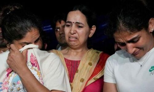 Medalists and award recipients in wrestling threaten to give back their honors.