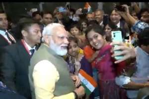 PM Modi Takes Selfies and Engages with Indian Community Upon Arrival in Japan for G7 Summit
