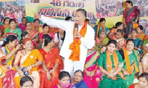 Prabhakar stages sit-in demanding allocation of 2 BHK houses to the underprivileged in Hyderabad