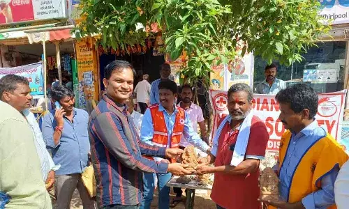 Lions Club of Mulugu and Indian Red Cross Society Mulugu join forces to distribute clay Ganesha idols