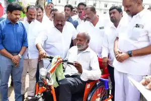 Disabled individuals receive tricycles from Gangula in Karimnagar.