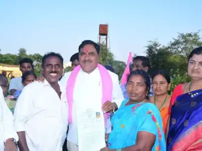 Land ownership papers distributed to SC beneficiaries in Warangal