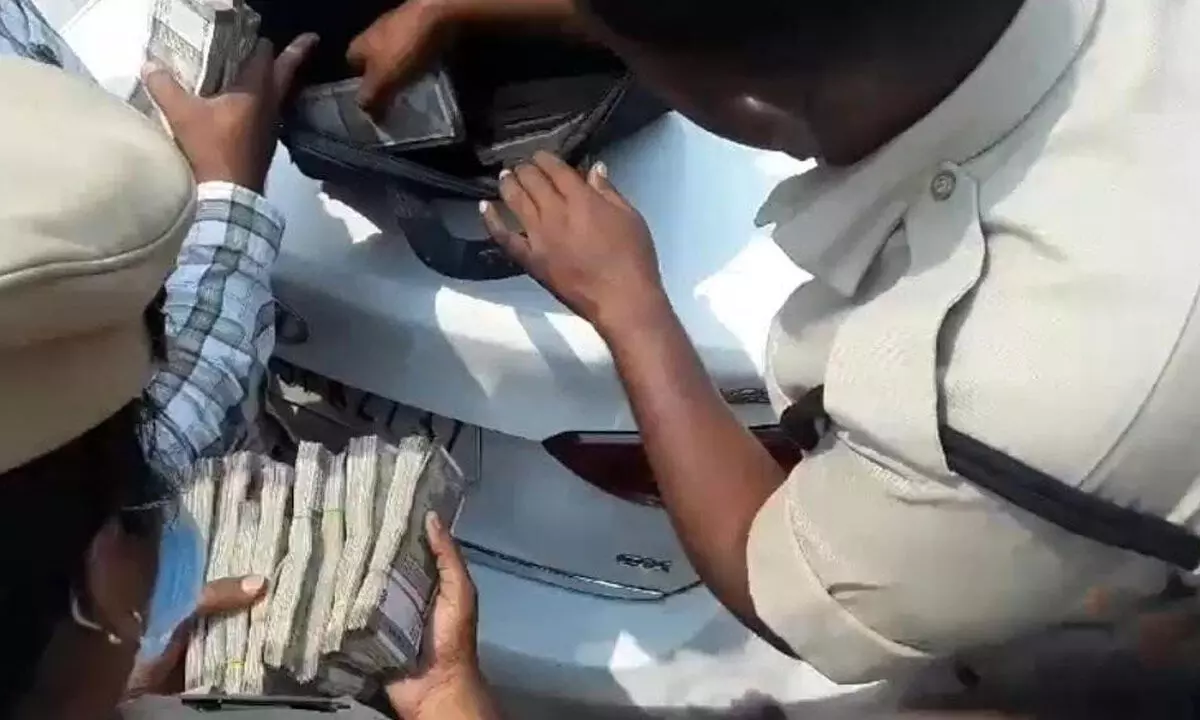 Police in Hyderabad seize large amounts of cash during vehicle checks in election code enforcement.
