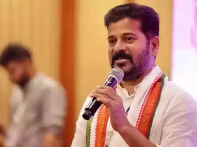 Revanth surrounded by Nagam supporters at Gandhi Bhavan