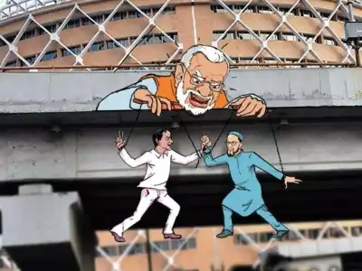Congress puts up posters portraying KCR and Owaisi as puppets under PM Modi’s control