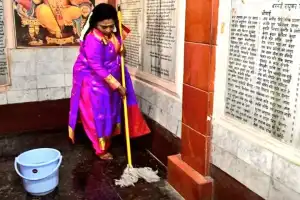 Dr Tamilisai of Hyderabad actively participates in temple cleaning with a broom