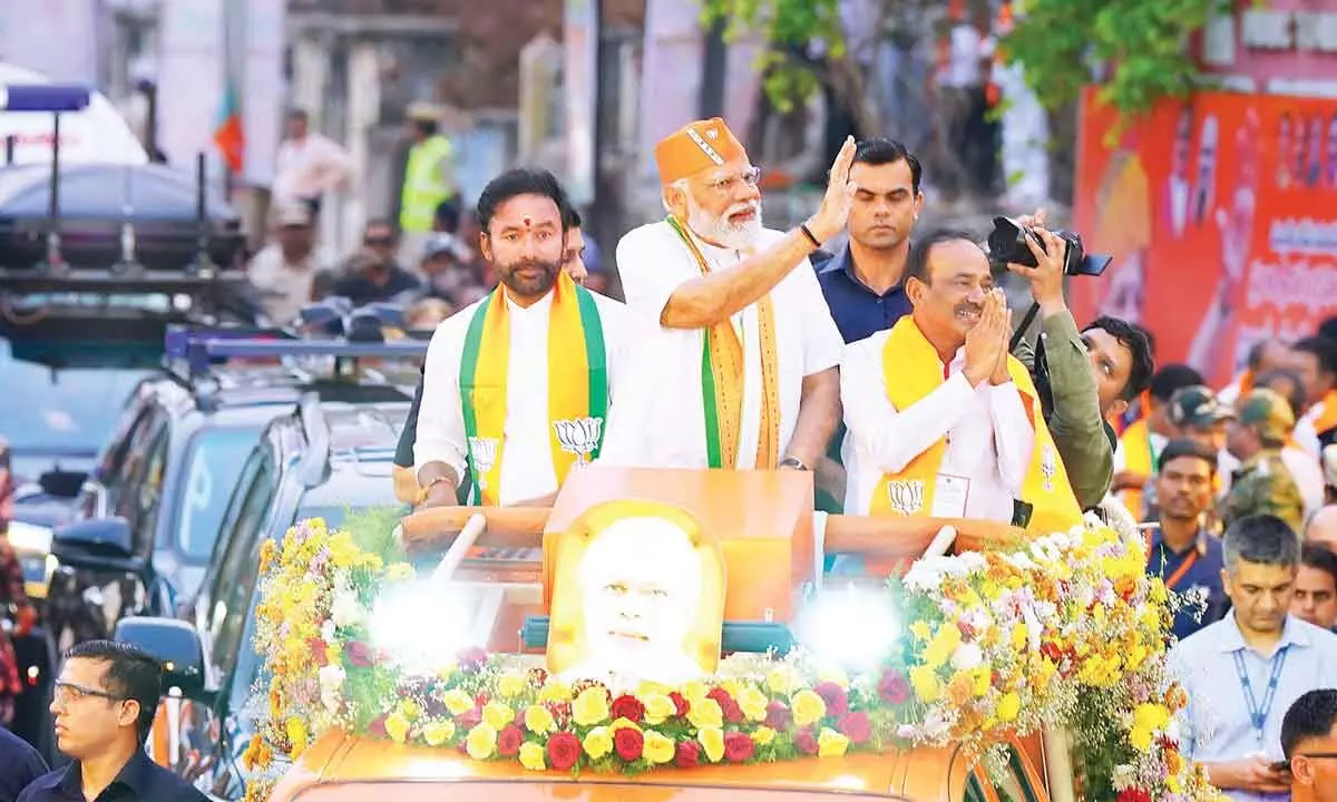 BJP cadre boosted by Modi’s road show in Malkajgiri