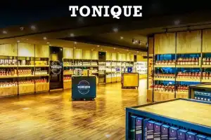 Identity of Donga and Dora Revealed in Liquor Scam: Excise Raids Expose GST Evasion at Tonique Wine Shops