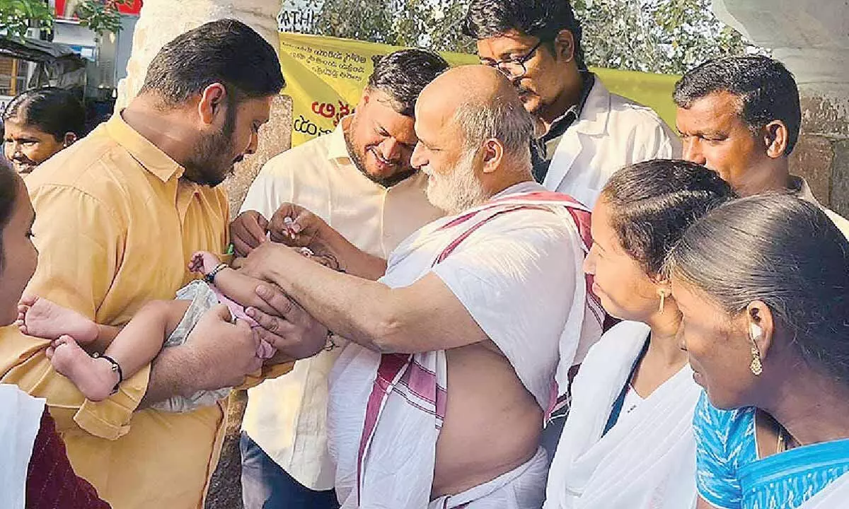 Priest at Chilkur Temple gives polio vaccinations