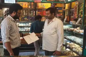 Manoj, food safety officer, conducts inspections at numerous restaurants