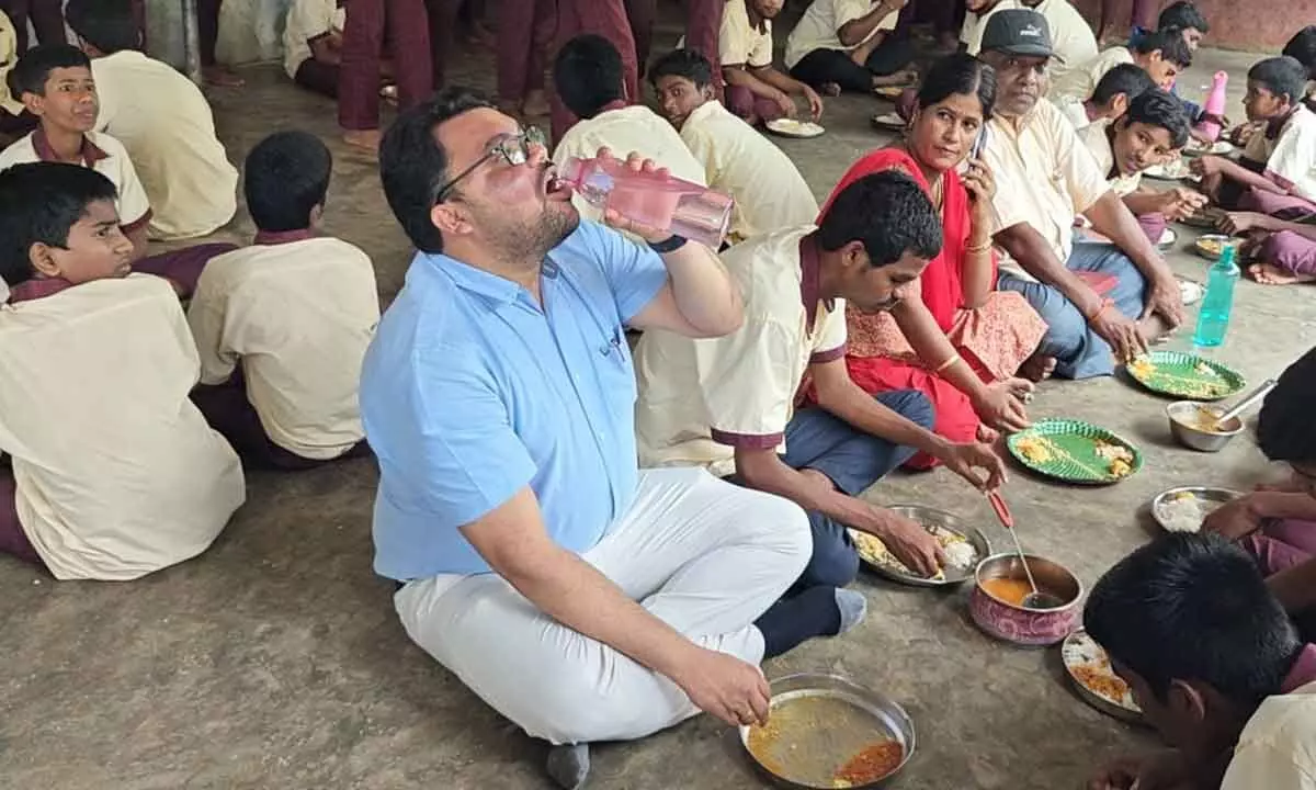 District Collector Shares Meal with Students