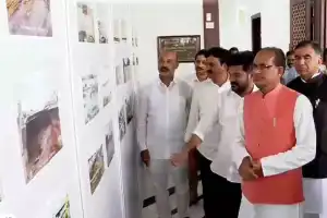 Central Ministers Assess Flood Damage at Photo Exhibition
