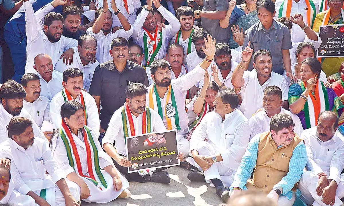 Revanth leads protest against Adani at Raj Bhavan