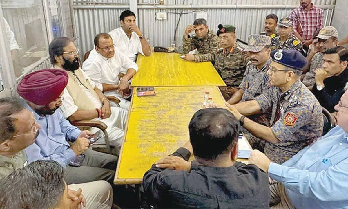 Debris blocks rescue efforts for trapped workers