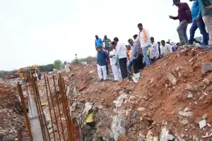 Residents protest against graveyard being used as a dump yard