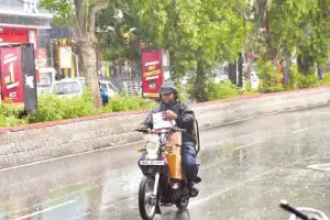 Rain and strong winds bring relief from summer heat