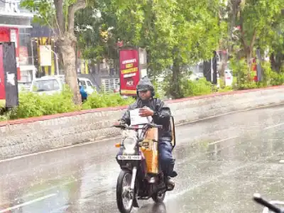 Rain and strong winds bring relief from summer heat