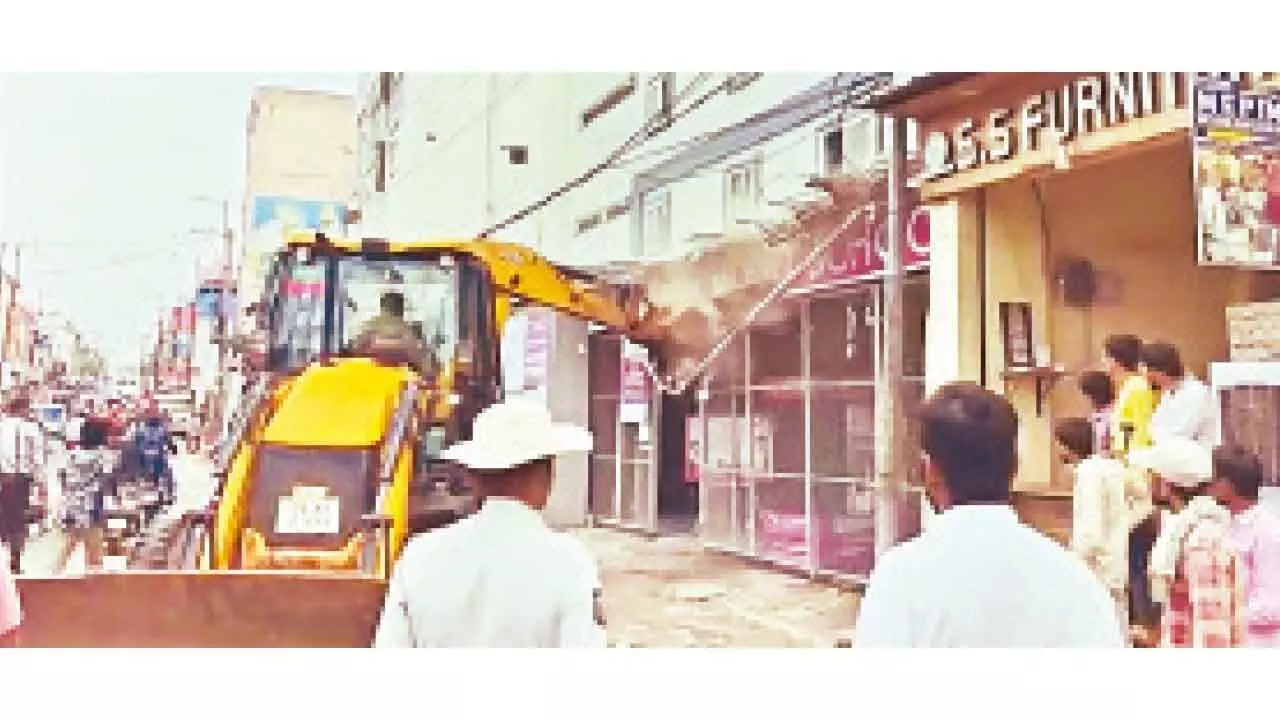 GHMC removes illegal structures on Asifnagar-Jhirra Road