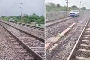 Drunk woman drives car on train tracks, causing delays