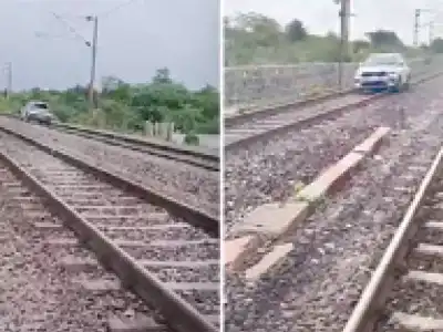 Drunk woman drives car on train tracks, causing delays