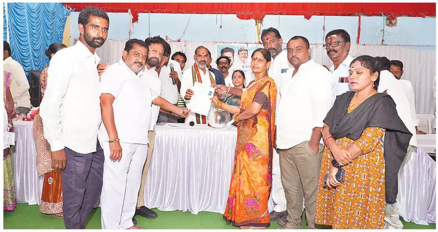 Government official hands out land ownership certificates