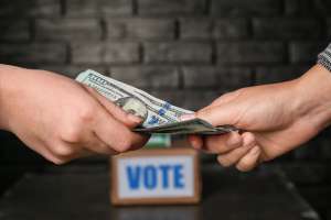 Political parties accused of giving money to voters before election