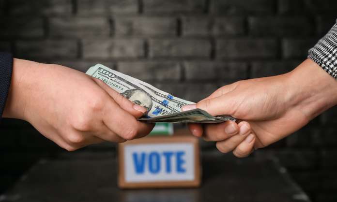Political parties accused of giving money to voters before election